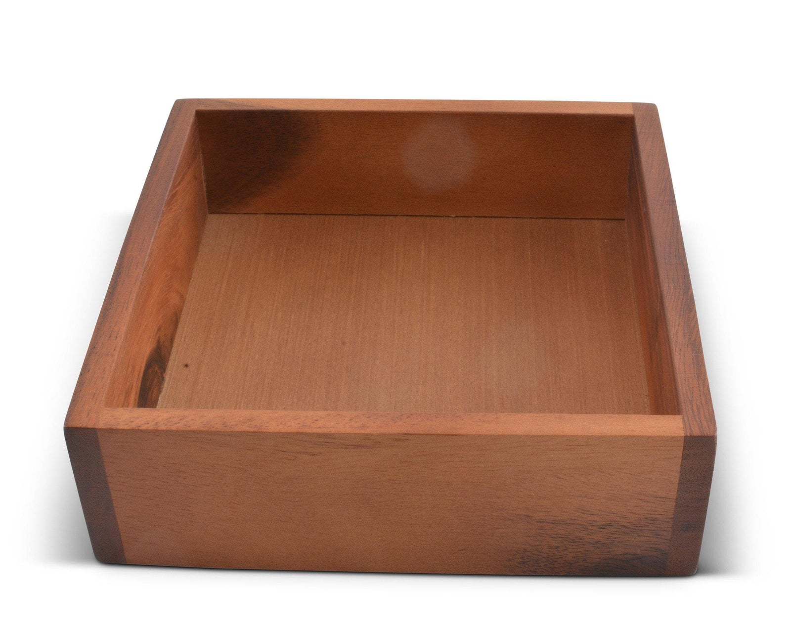 Wooden napkin holder in a close-up shot, showcasing artisanal craftsmanship as a modern classic kitchen decor.
