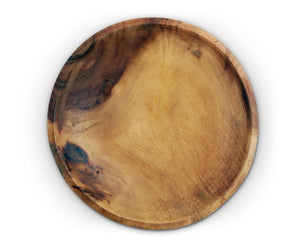A handcrafted wooden salad bowl, viewed from above, showcasing its natural grain as a luxurious serving piece.