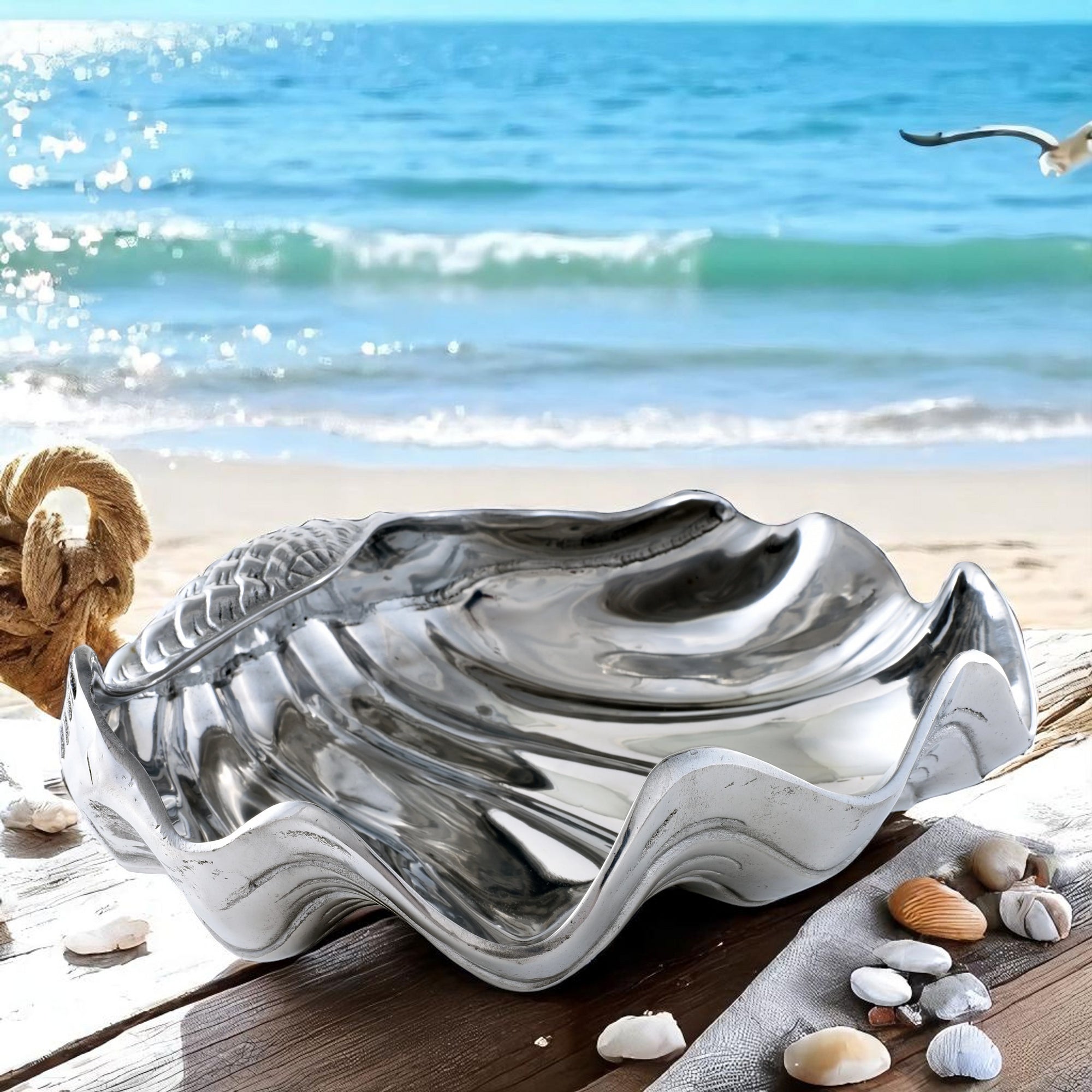 A decorative serving bowl inspired by a seashell, captured in a side angle, ideal for coastal decor.