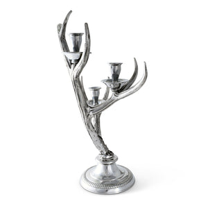 Silver antler candlestick viewed from a slight angle, showcasing its elegant craftsmanship, a perfect luxury home accessory.