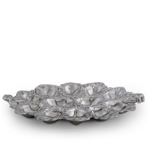Elegant deviled egg holder crafted from premium material, viewed from a side angle, featuring leaf-inspired details.