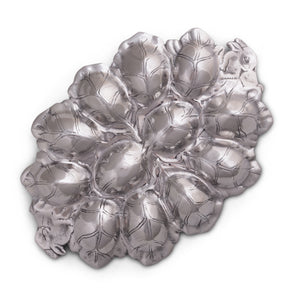 Leaf-patterned deviled egg holder shown from a top angle, showcasing its elegant accent and artisanal craftsmanship.