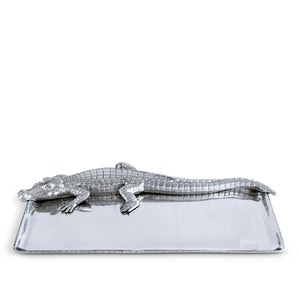 A crocodile-shaped silver tray viewed from the front, showcasing modern classic design and statement piece appeal.