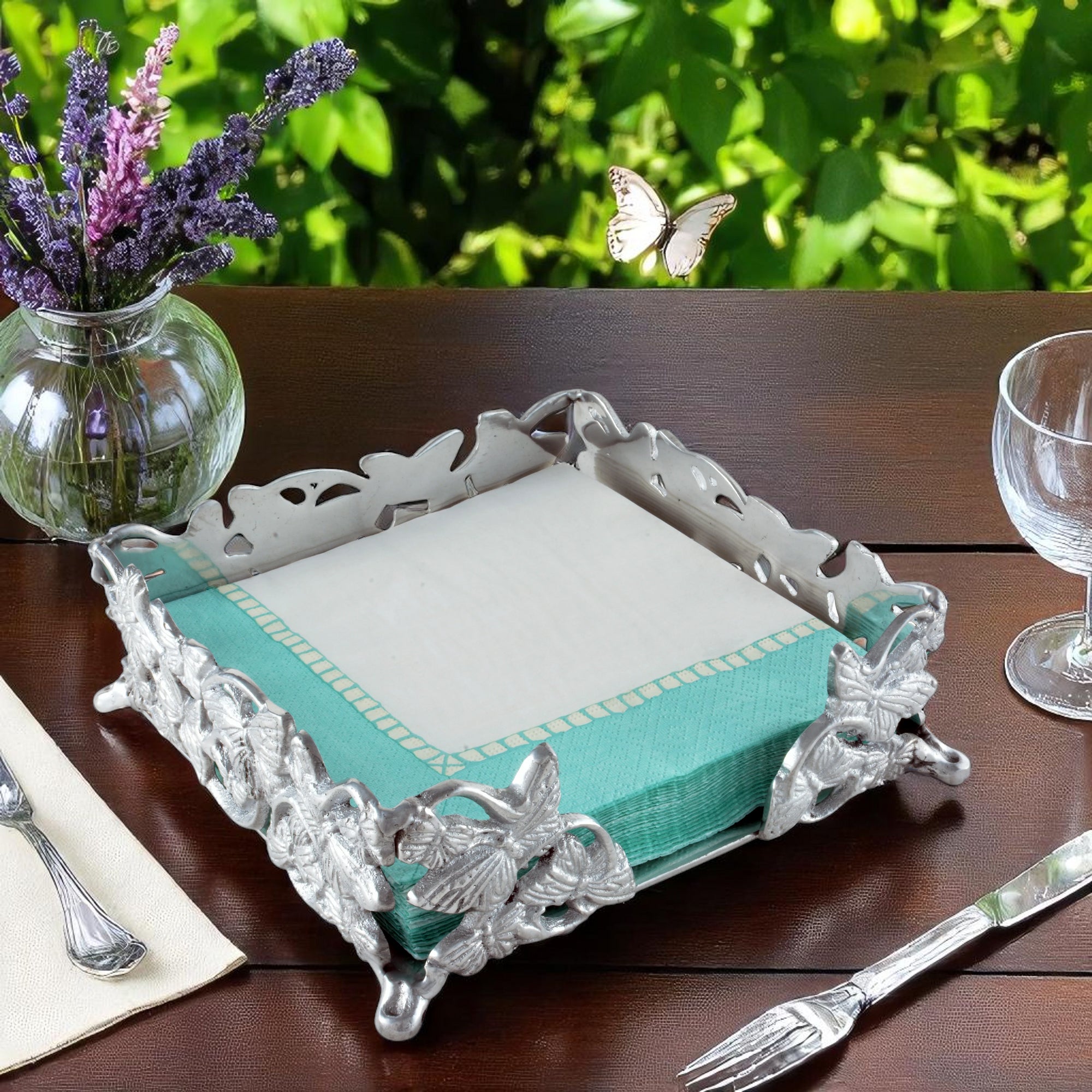 Elegant napkin holder with floral detailing viewed from a slight angle, showcasing artisanal craftsmanship and timeless design.