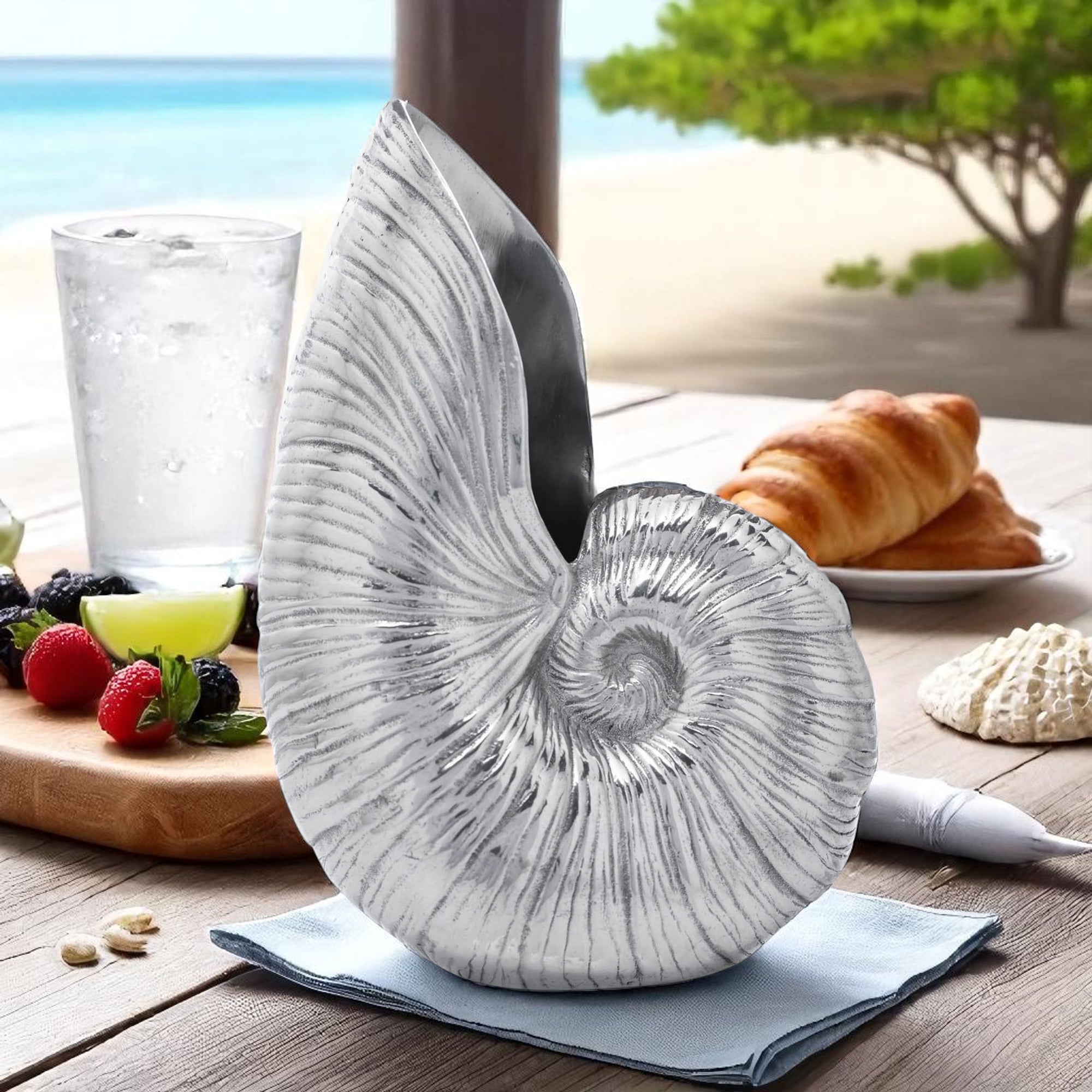 A seashell-inspired pitcher with intricate details, angled for a striking view, showcasing artisanal craftsmanship and coastal decor.