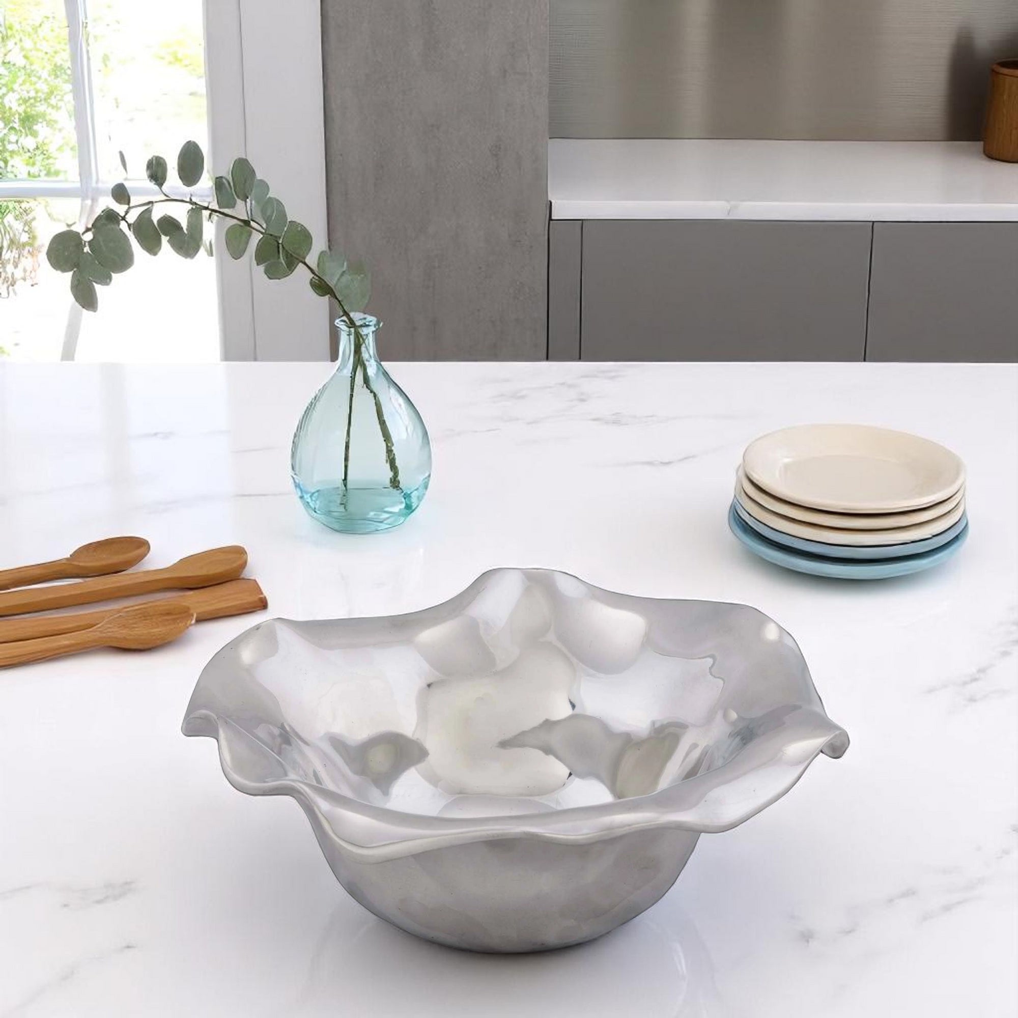 A wave-patterned dip bowl viewed from the side, showcasing its elegant curves and premium material, ideal for coastal decor.