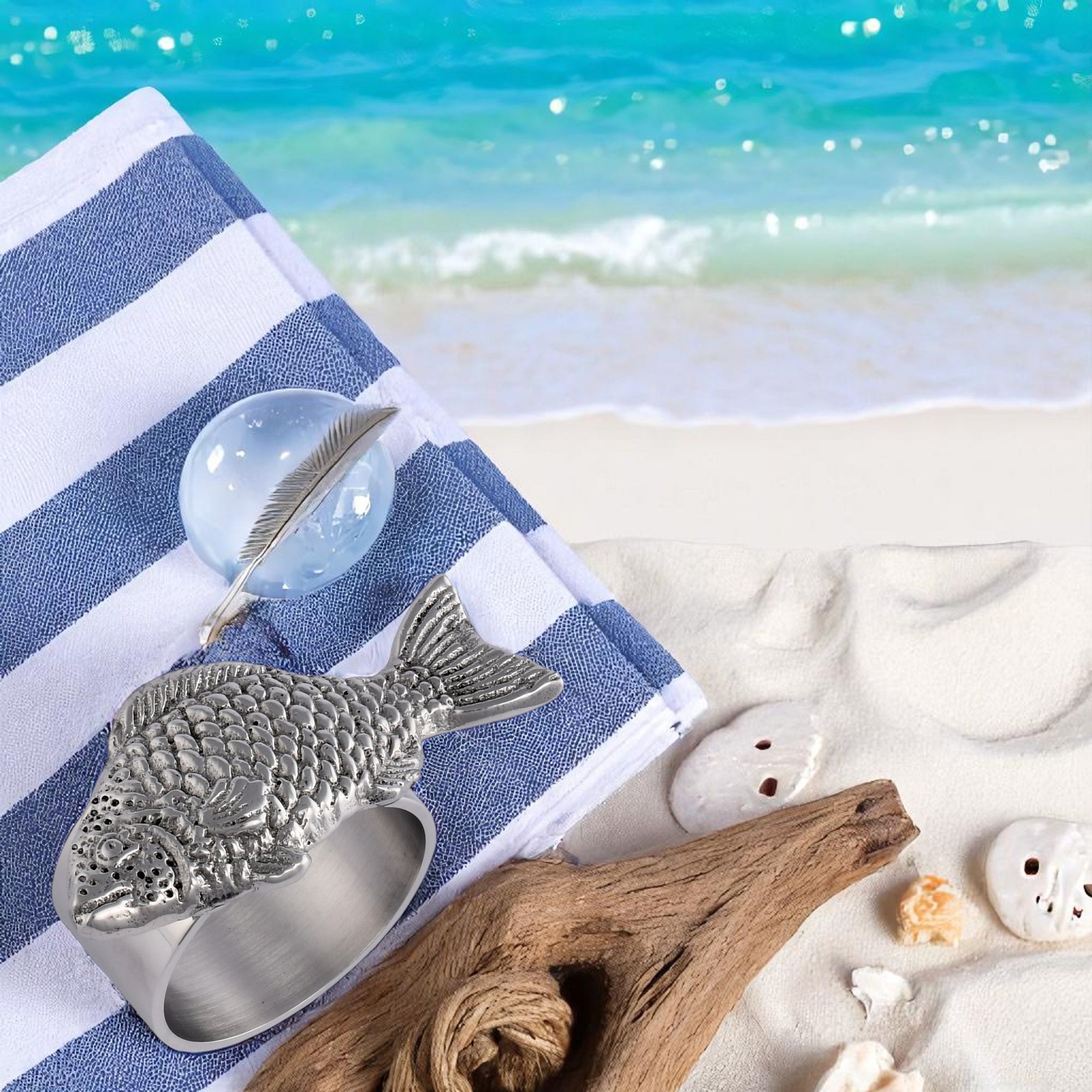 Close-up view of silver fish-shaped napkin rings showcasing artisanal craftsmanship, perfect as elegant table setting accessories.