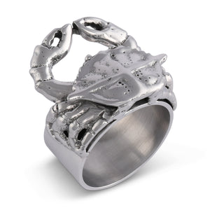 In an angled shot, a silver crab-shaped napkin ring showcases artisanal craftsmanship, perfect for coastal decor and table setting.
