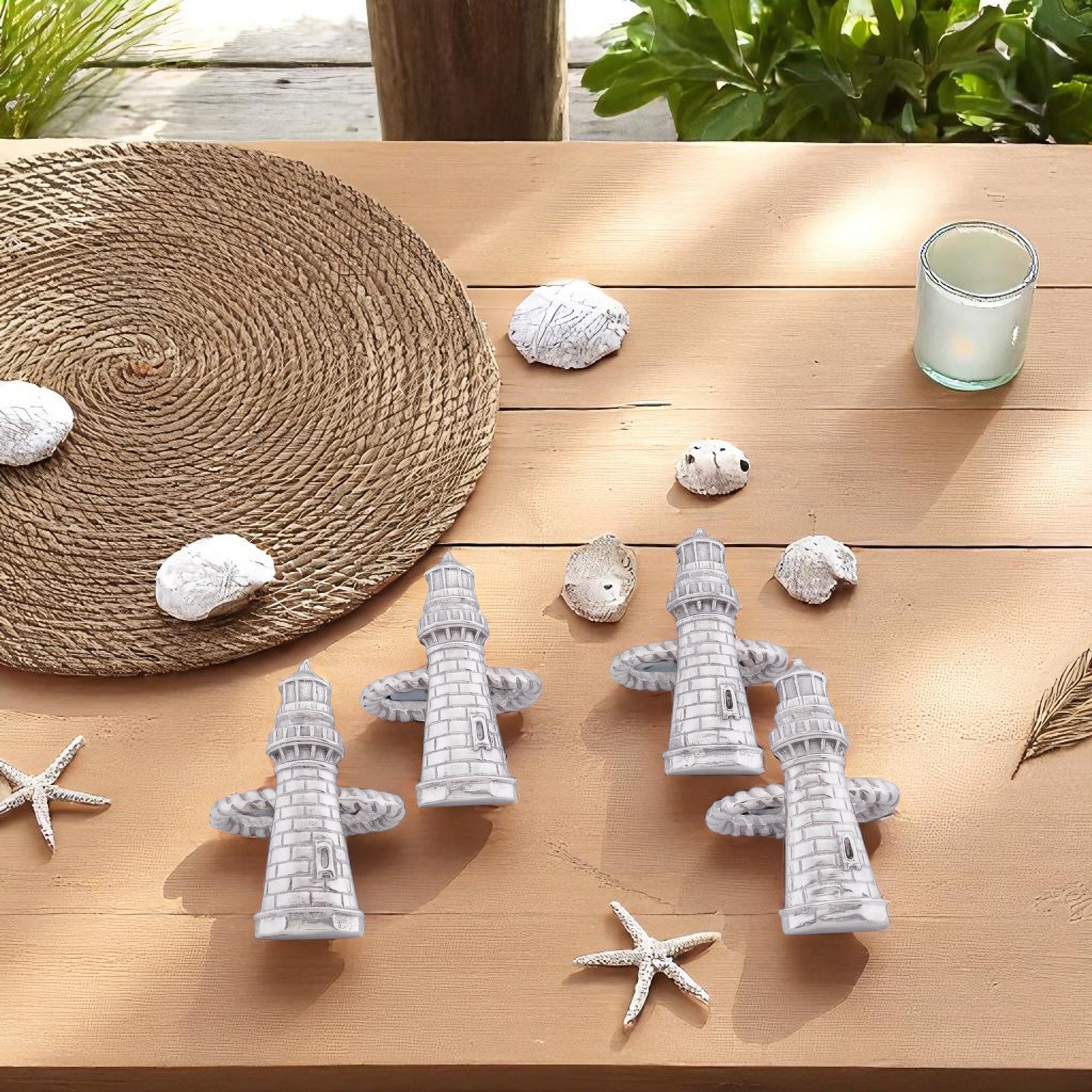 Lighthouse-themed napkin rings viewed from above, showcasing artisan craftsmanship and coastal decor for elegant table settings.