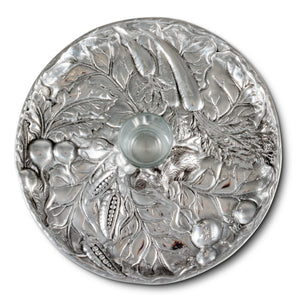 A decorative bowl crafted with intricate leafy patterns surrounds a glass centerpiece, seen from above; perfect as a luxury home accessory.