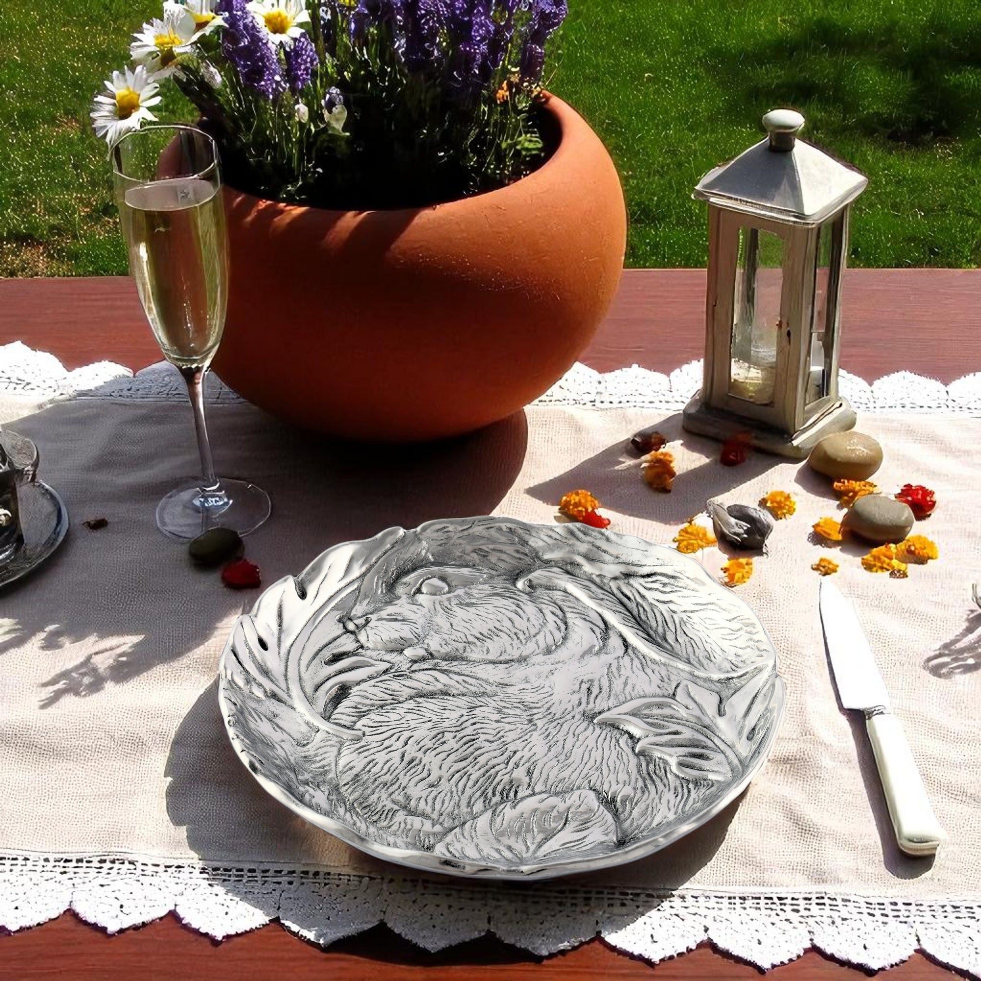 In an angled view, an intricately detailed cheese set features artisan craftsmanship, making it a perfect decorative bowl for elegant table settings.