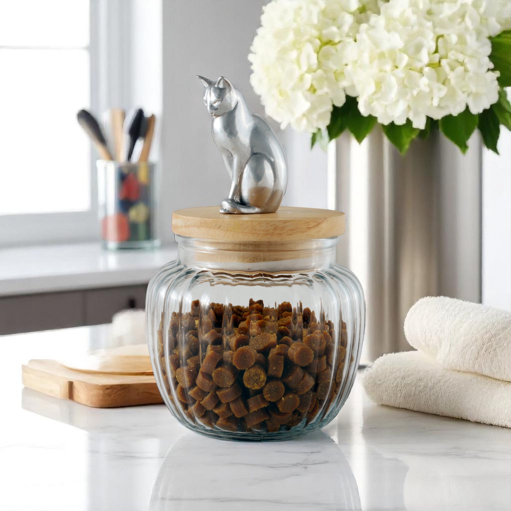 Elegant canister with a metallic cat figurine lid viewed from the side, ideal for luxury home accessory decor.