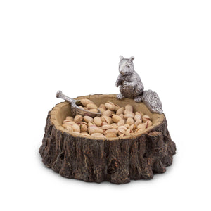 A nut bowl viewed from a side angle, featuring a detailed squirrel figurine and pistachios, ideal for kitchen decor.