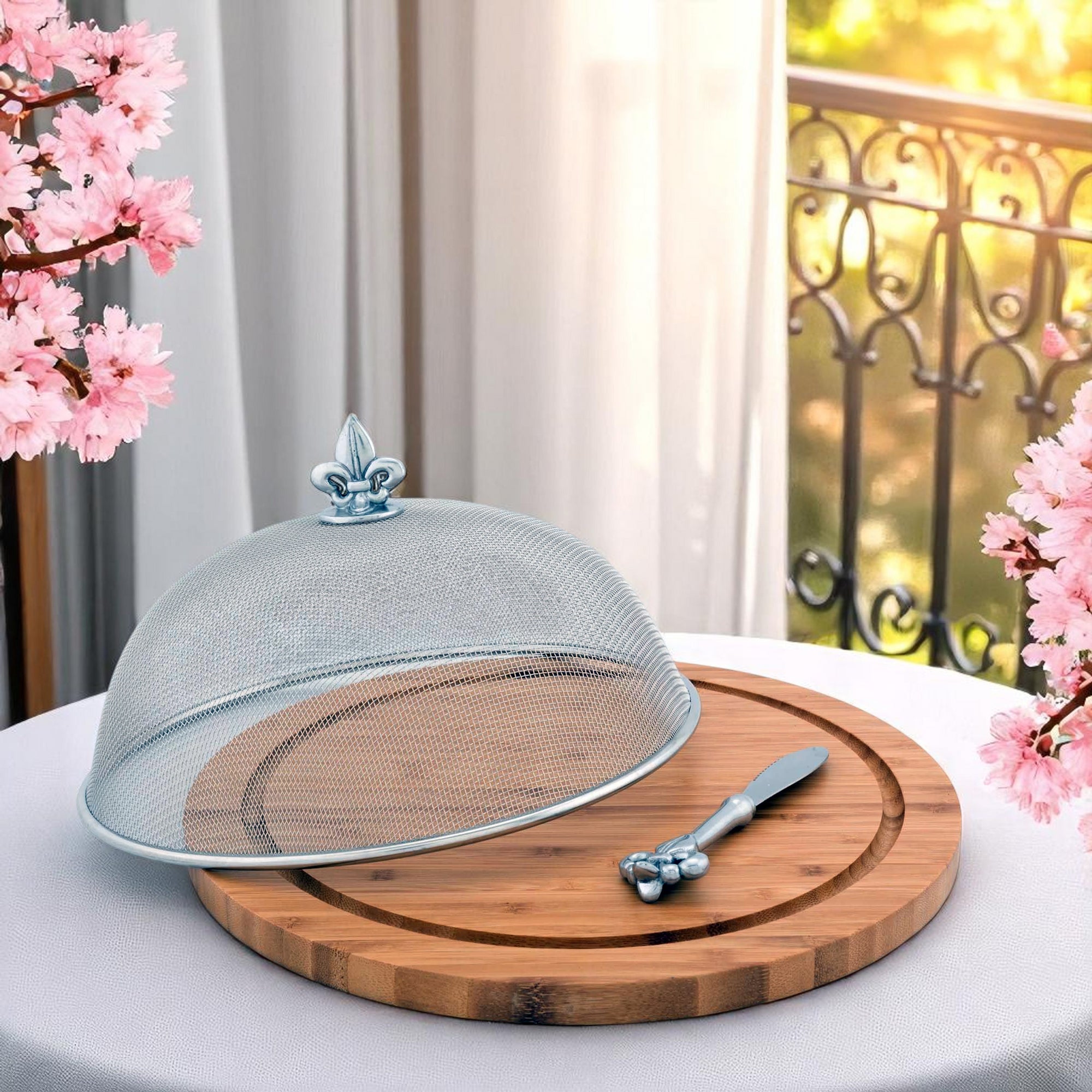 Cheese set with a domed mesh cover and wooden board in an angled shot, showcasing artisanal craftsmanship and elegance.