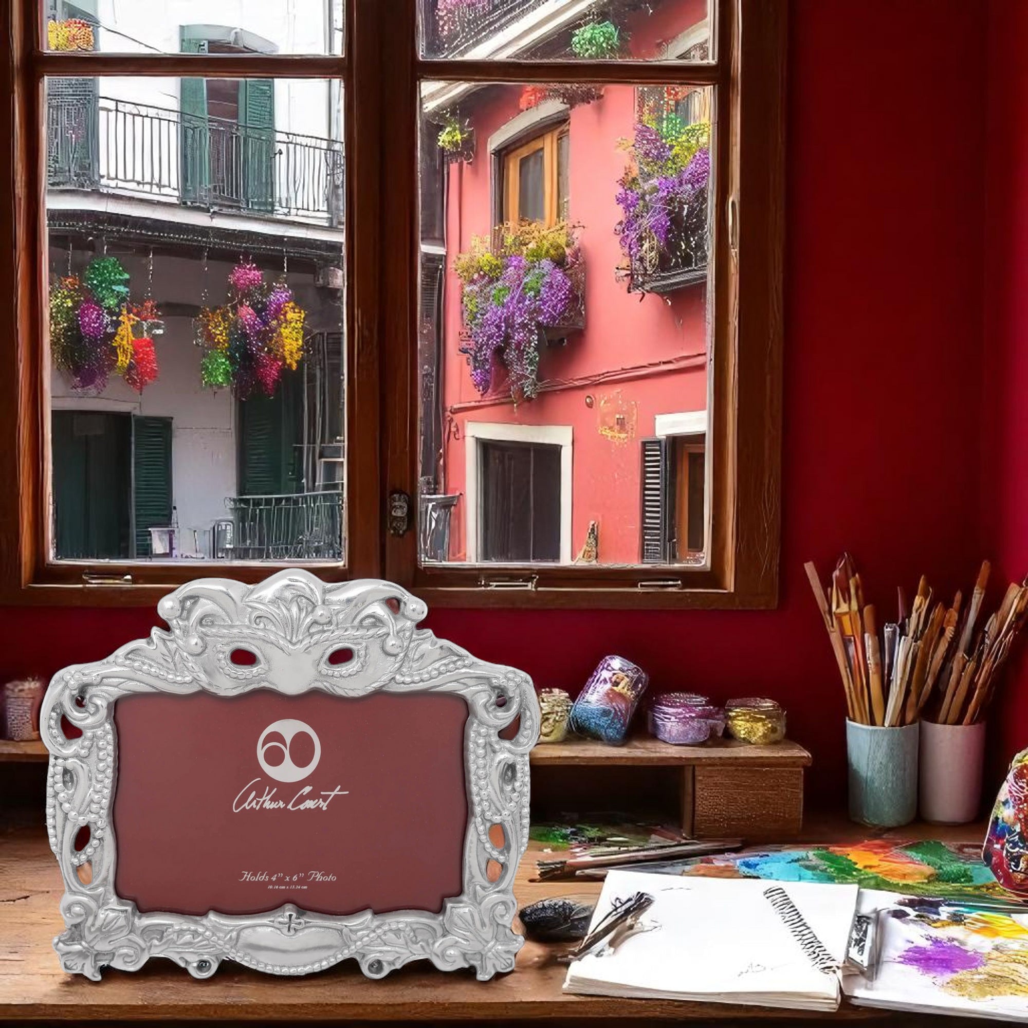 Ornate Arthur Court photo frame viewed straight-on, showcasing intricate handcrafted detail in silver on a red background
