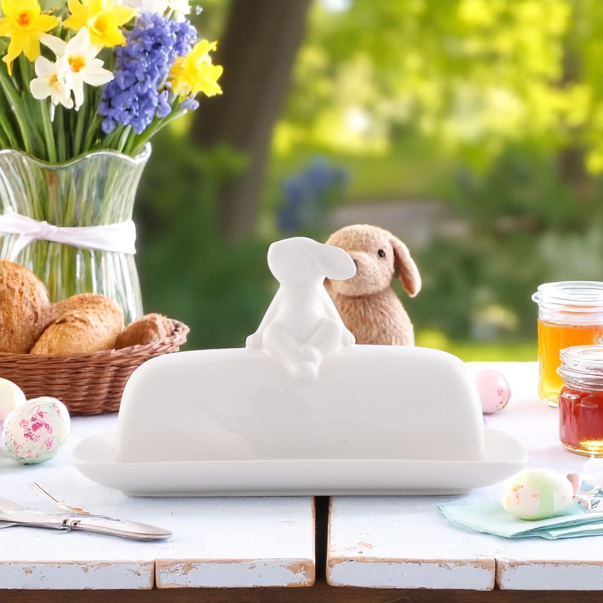 Charming butter dish with rabbit figurine viewed from the front, ideal for kitchen decor and entertaining essentials.