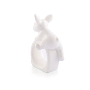 Charming rabbit-shaped napkin ring in white ceramic, angled for a whimsical touch to table settings.
