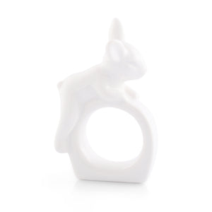 Elegant white ceramic napkin ring with playful animal design, viewed from the side, ideal for modern table settings