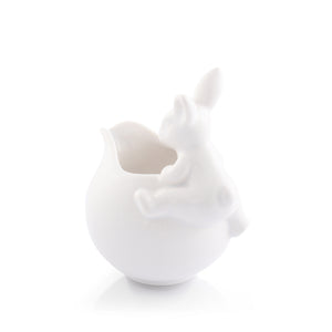 A whimsical creamer bowl featuring a rabbit design, seen from a side angle, perfect for luxury home decor.
