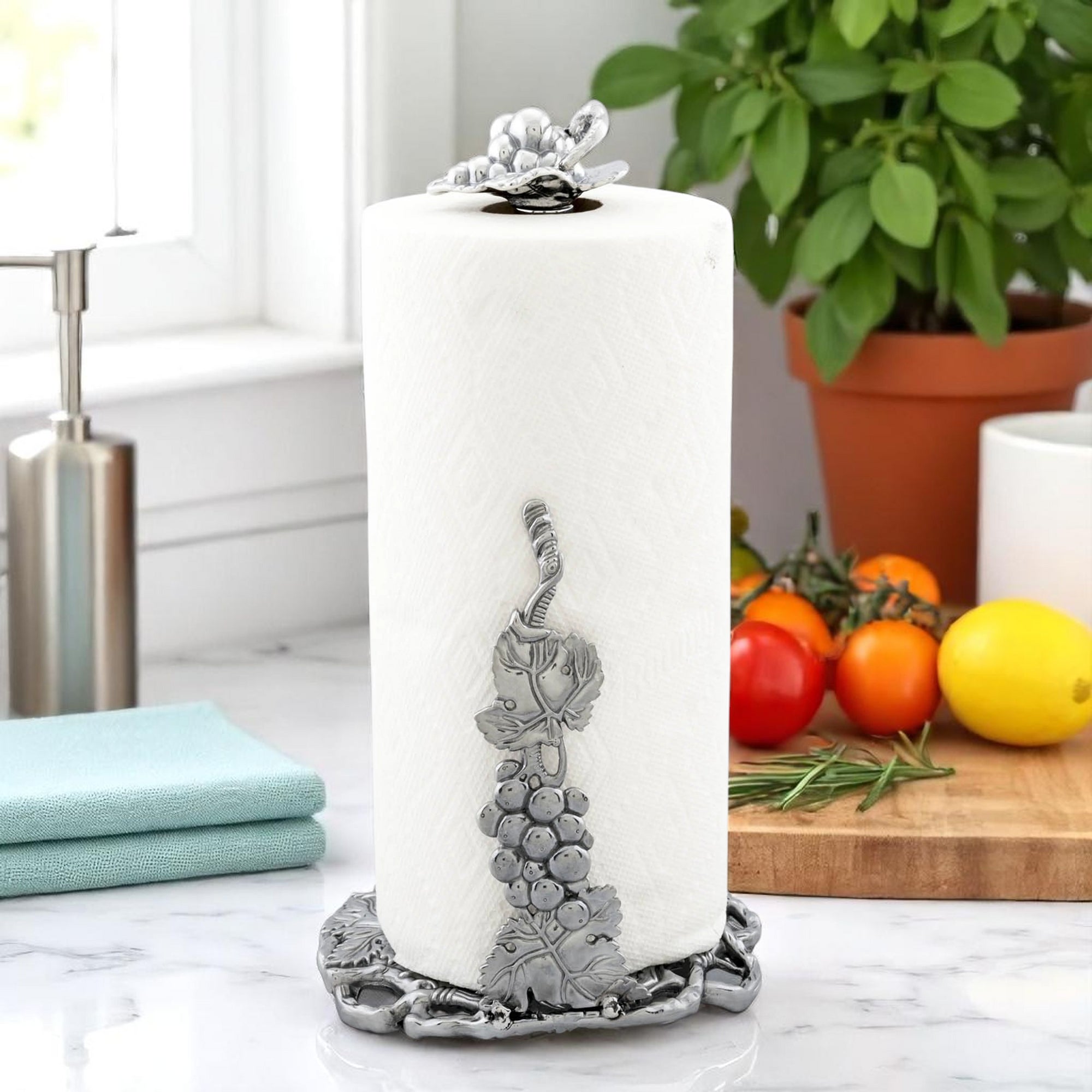 Elegant paper towel holder featuring grapevine details, viewed from the side, perfect for coastal decor enthusiasts.