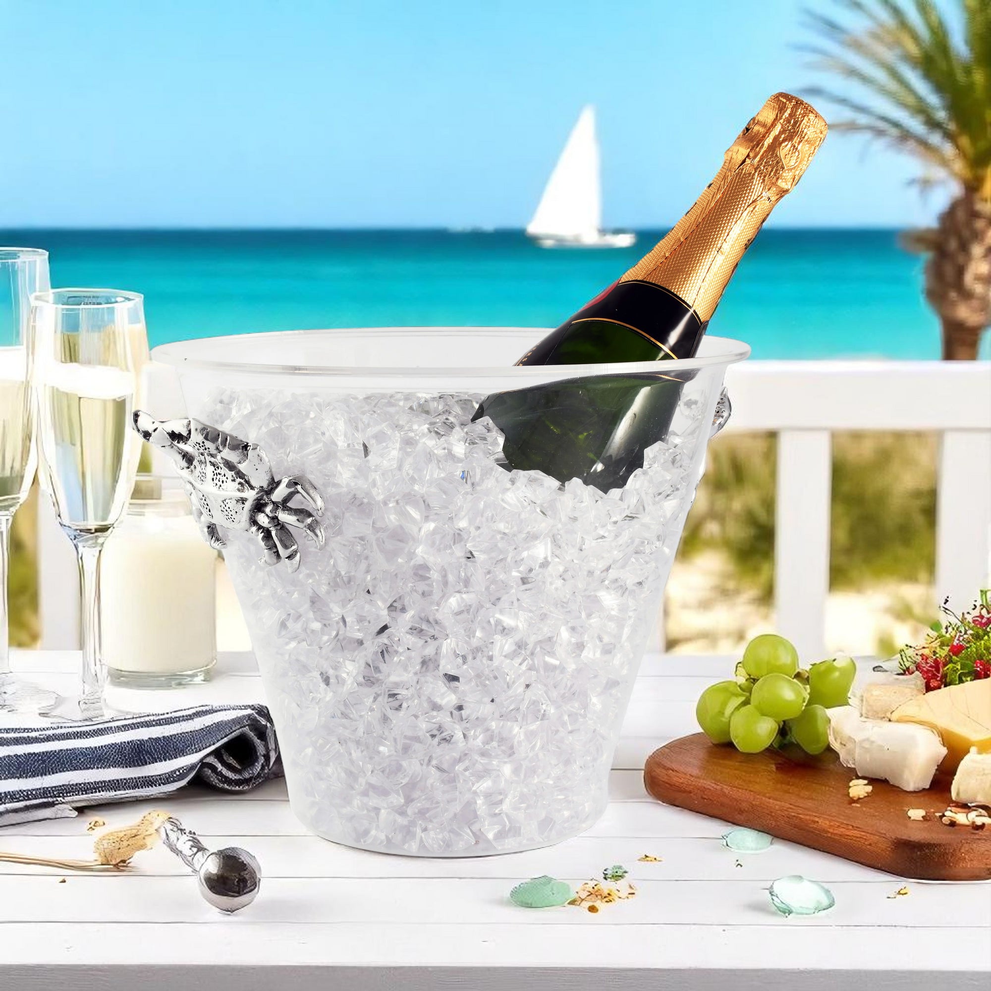 A stylish ice bucket with a champagne bottle, viewed from the side, featuring crab-themed handles, perfect for coastal decor.