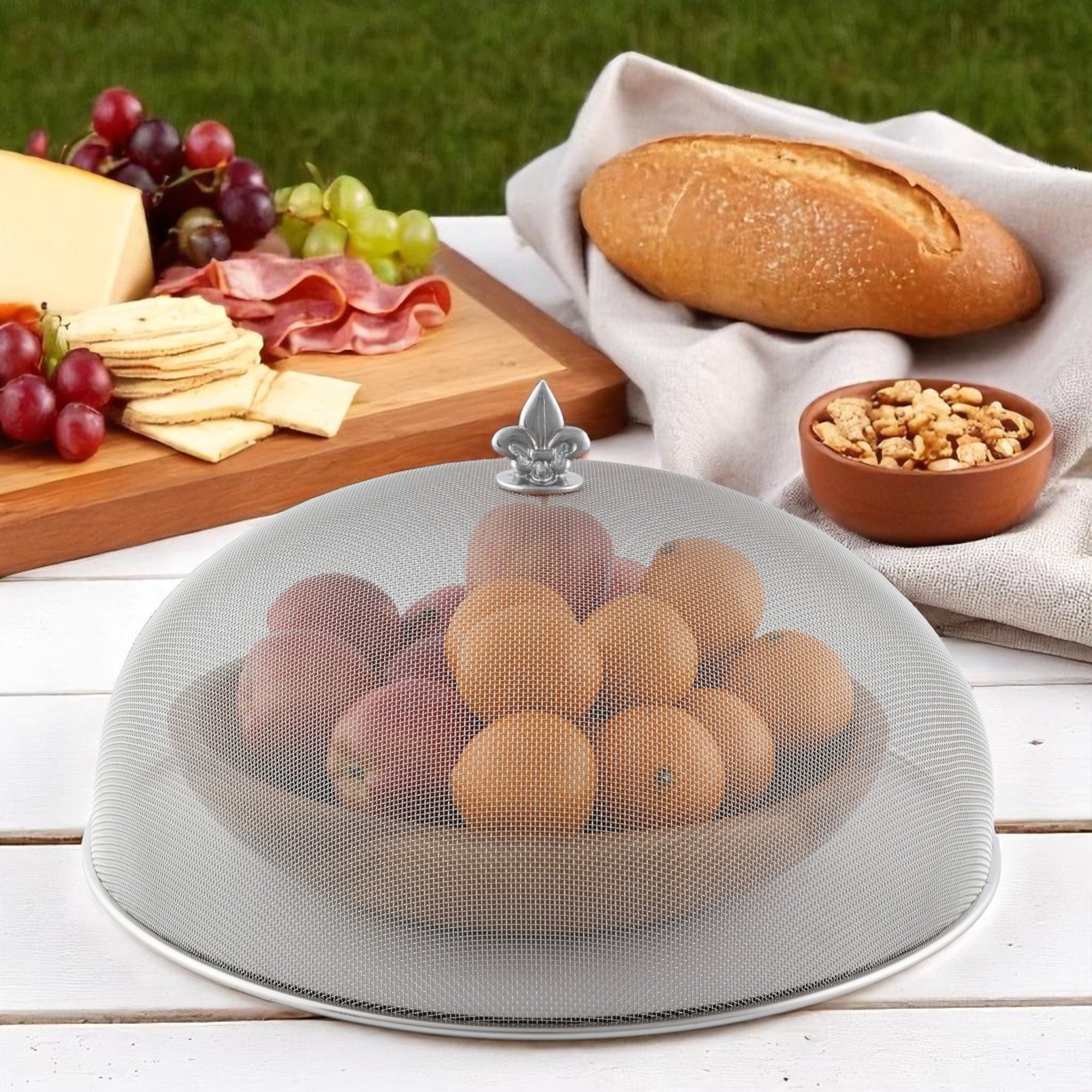 A mesh picnic cover with a decorative finial seen from above, ideal for outdoor entertaining essentials.