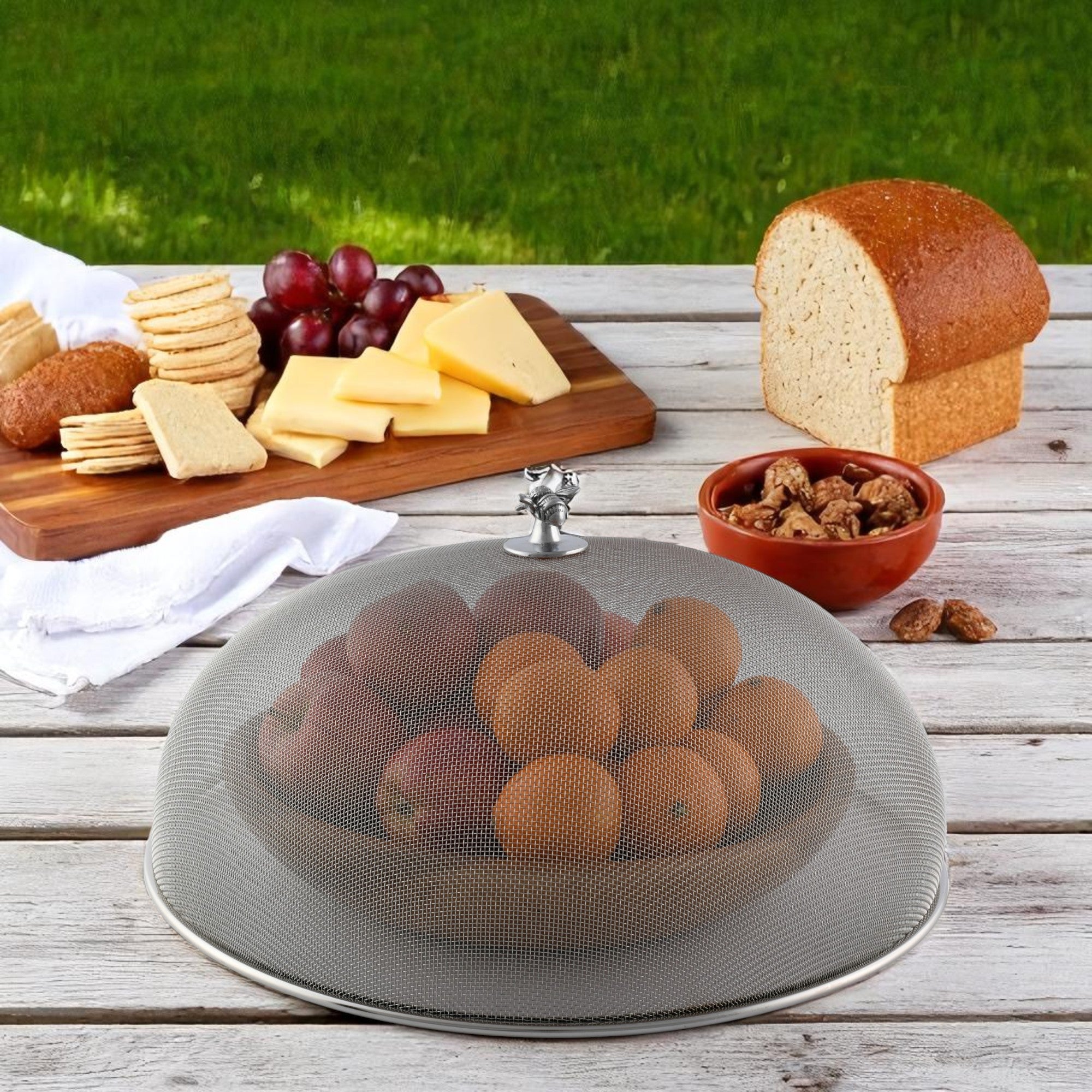 A mesh picnic cover viewed at an angle, featuring a bee-shaped handle and ideal for outdoor entertaining essentials.