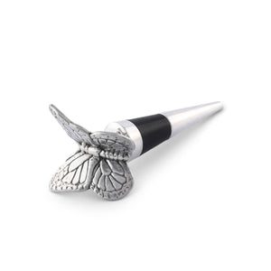 A butterfly bottle stopper angled towards the viewer, showcasing artisanal craftsmanship and a sleek design.