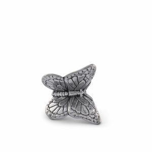 Butterfly bottle stopper crafted in silver, viewed from a close-up angle, showcasing intricate artisanal craftsmanship.