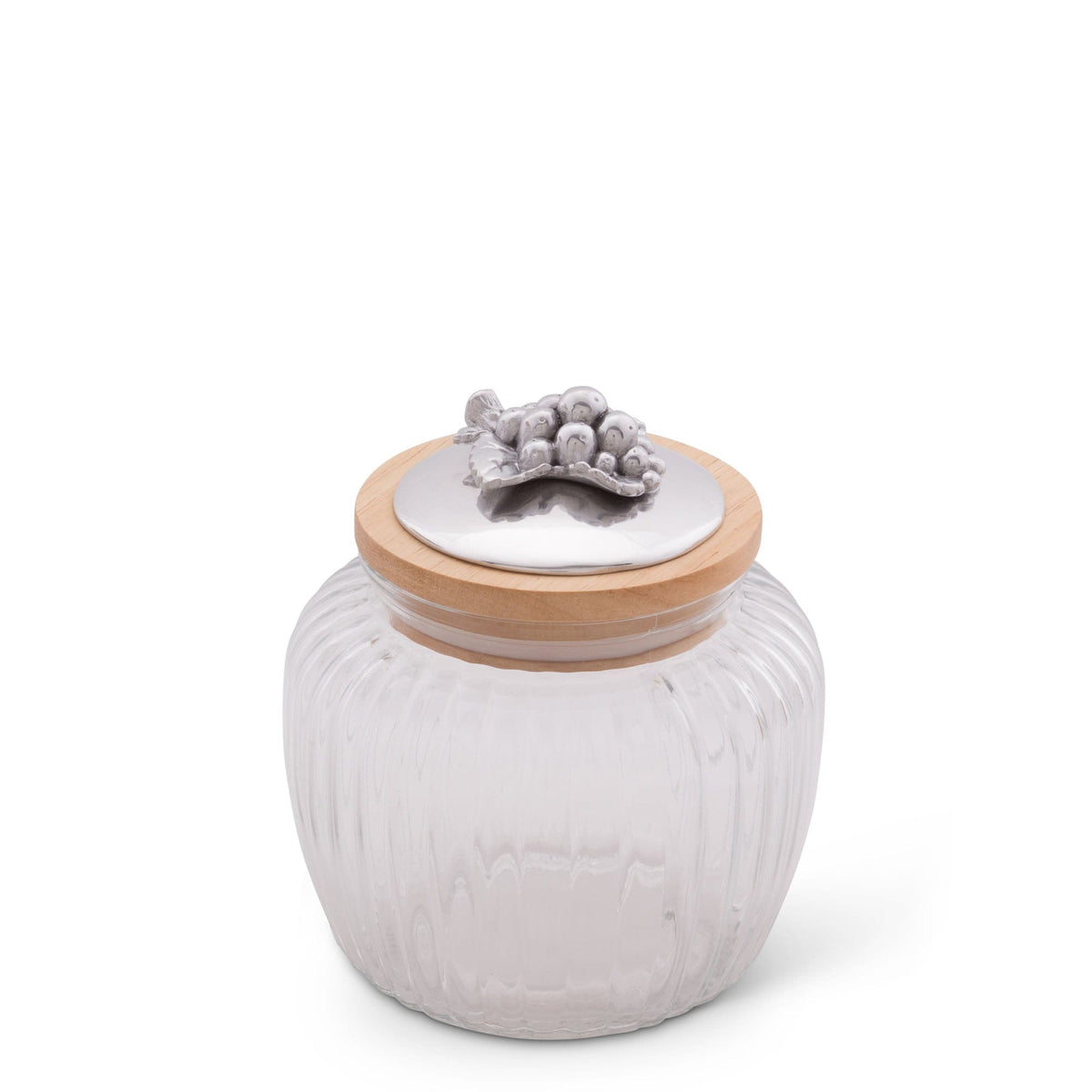 Elegant glass canister with a silver fruit-accented lid, viewed from a slightly elevated angle, embodies artisanal craftsmanship.