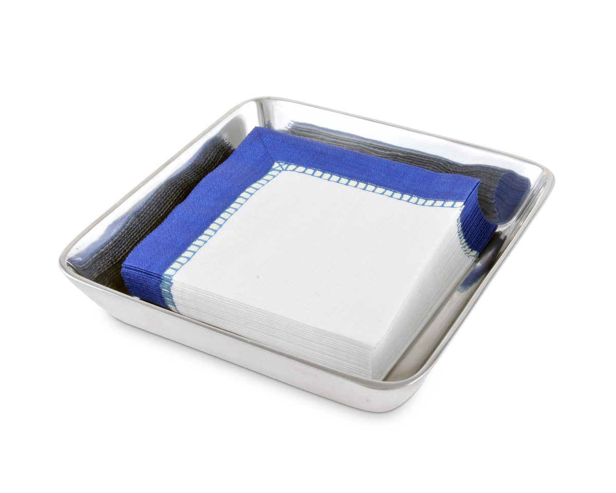 Sleek napkin holder with blue and white napkins viewed from the side, embodying modern classic tableware.
