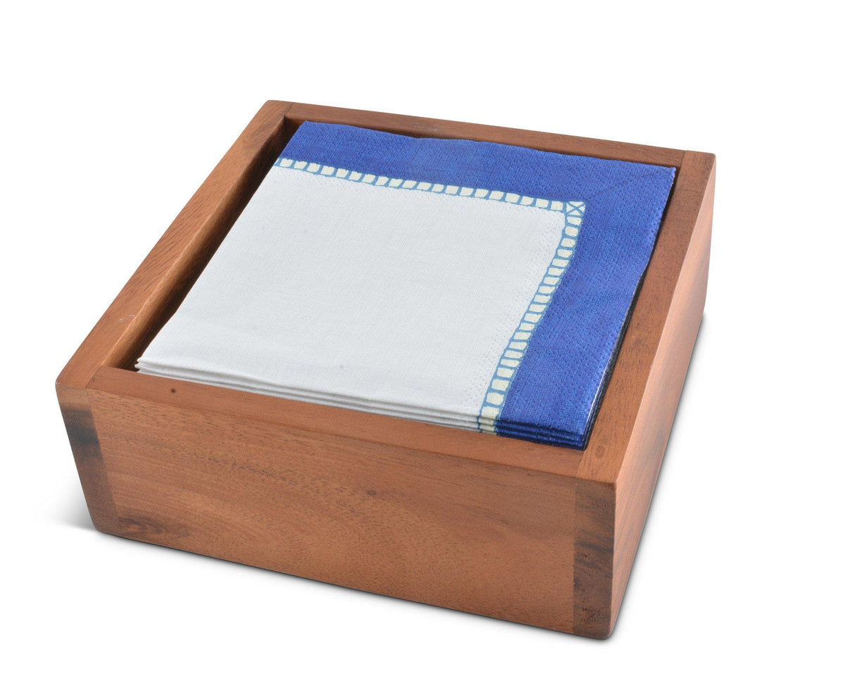 Wooden napkin holder viewed from above, showcasing a stack of blue and white napkins, ideal kitchen decor.