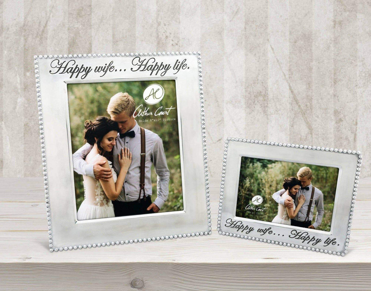 Two elegant photo frames adorned with delicate bead detailing and "Happy wife... Happy life" inscriptions, viewed at an angle on a wooden surface.