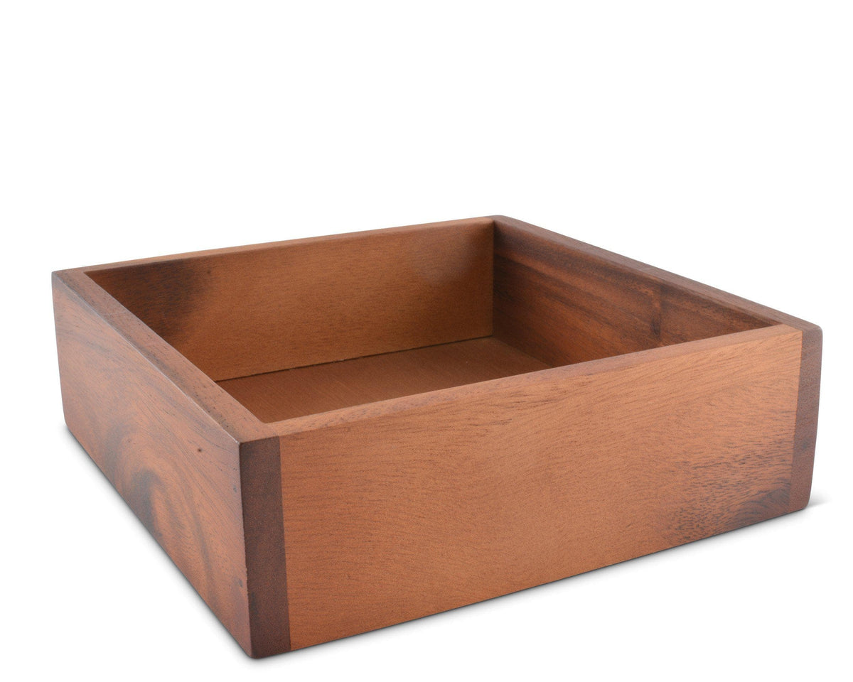 A wooden napkin holder with a natural finish, viewed from a side angle, showcasing elegant accent in kitchen decor.