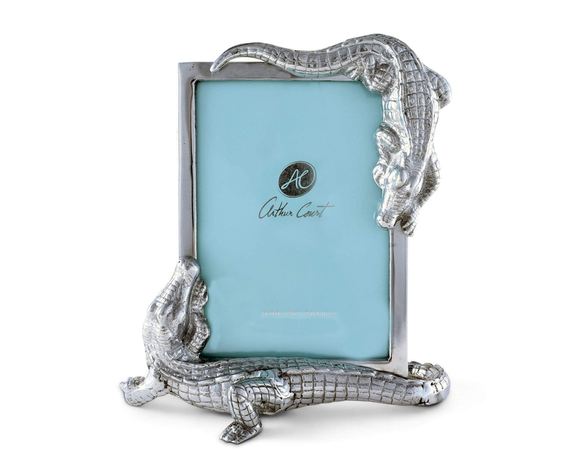 A crocodile-themed picture frame with intricate detailing is captured from the front, showcasing its unique luxury home accessory design.