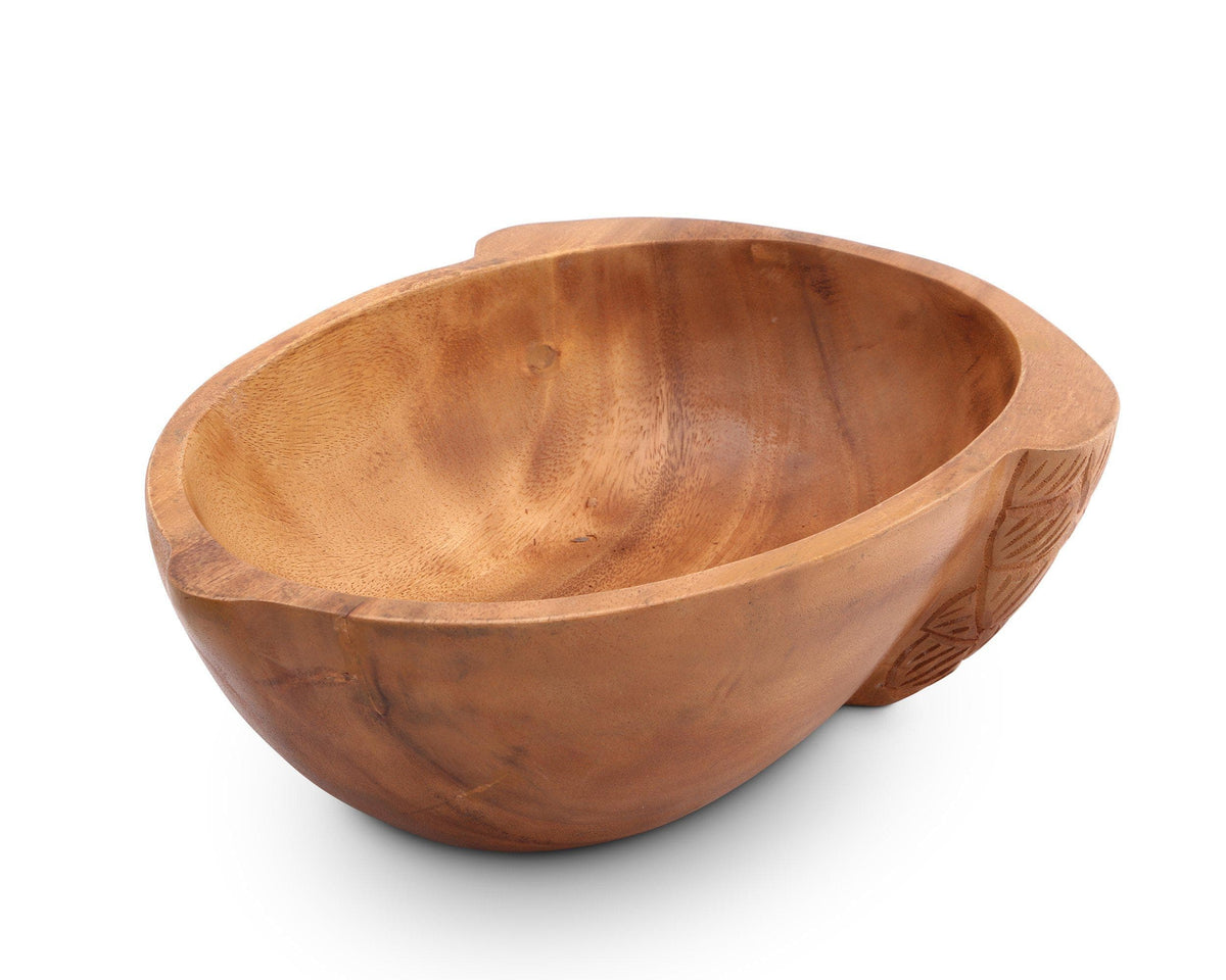 Handcrafted wooden salad bowl with intricate detailing on the side, viewed at an angle, ideal for kitchen decor.