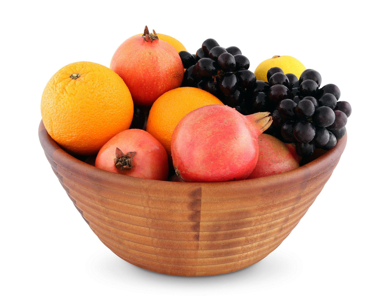 Wooden salad bowl viewed from the side, filled with vibrant fruits, perfect for coastal decor and kitchen essentials.