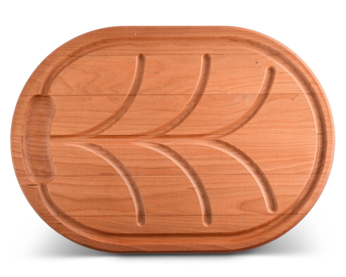 Aerial view of a premium carving board with leaf design, showcasing artisanal craftsmanship and ideal for kitchen decor.