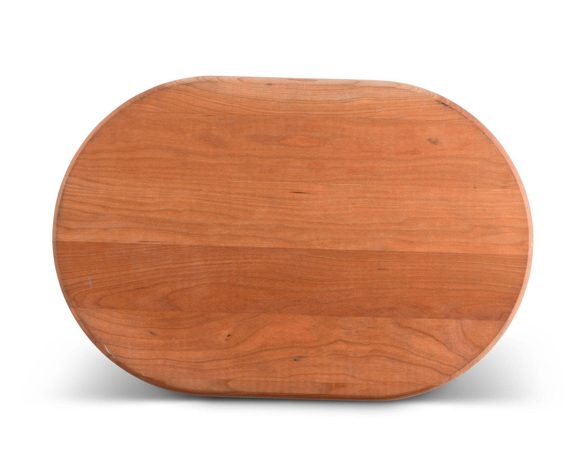 Oval carving board made from rich wood, viewed directly from above, showcasing artisanal craftsmanship and luxurious kitchen decor.