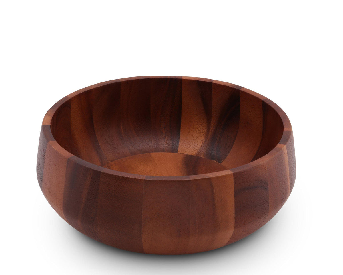 In a close-up angled view, a wooden salad bowl showcases its rich grain, ideal for modern classic table settings.