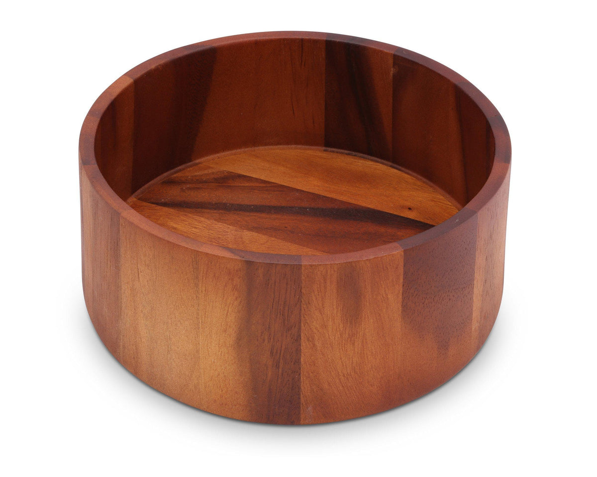 A modern classic salad bowl with rich wood grain is viewed at an angle, showcasing its artisanal craftsmanship.