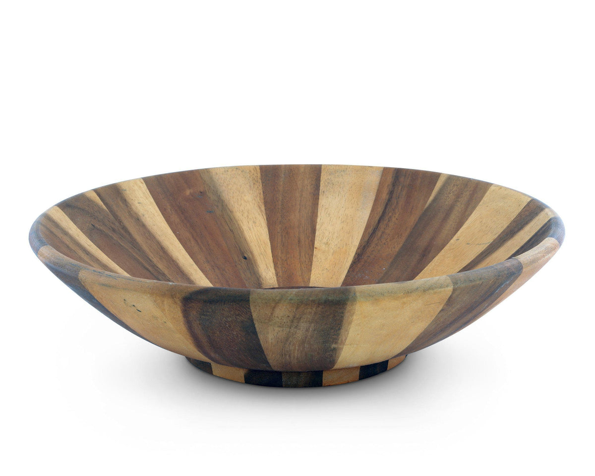 A handcrafted wooden salad bowl viewed from a side angle, showcasing artisanal craftsmanship and creating an elegant accent.