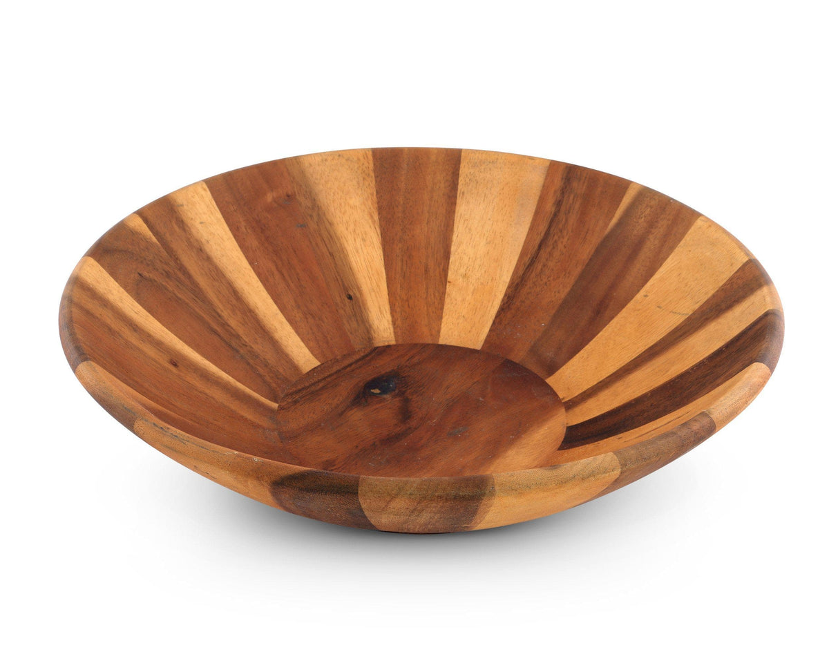 This designer tableware features a handcrafted wooden salad bowl, viewed from an angled perspective to highlight its artisanal craftsmanship.